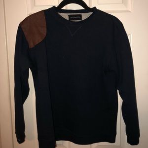 Crew neck sweater with leather detail